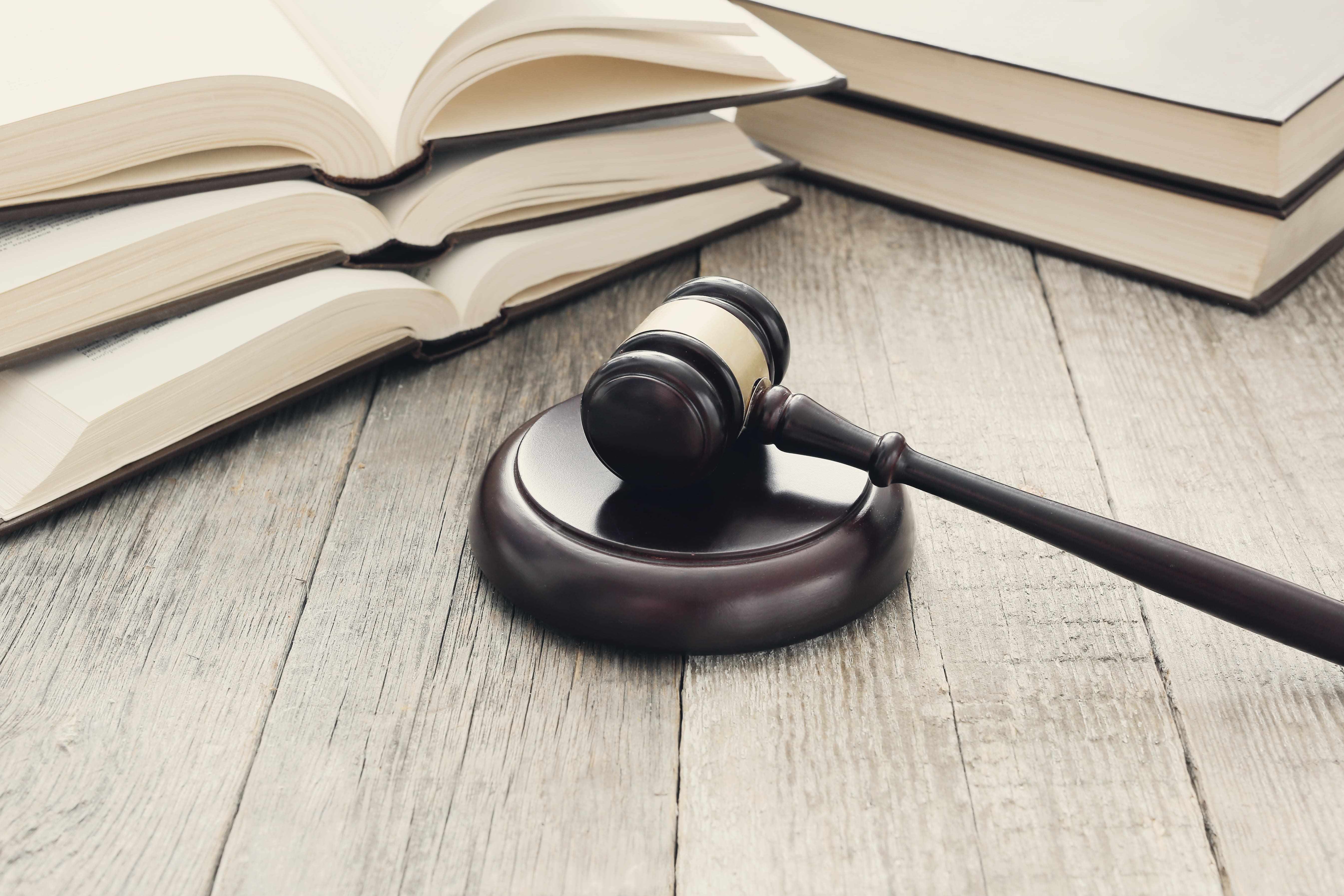 court hammer books judgment law concept min ok